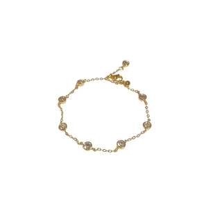 Elegant gold chain bracelet with green zircon and pearl star charms on white background
