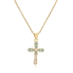 Gold cross necklace with turquoise and cubic zirconia inlay on a polished link chain
