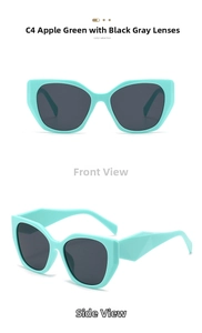 Detail of mint green cat eye sunglasses with gray lenses and geometric temples