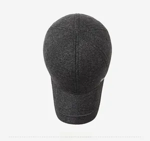 Top view of a charcoal gray wool baseball cap with melange texture and metal logo detail