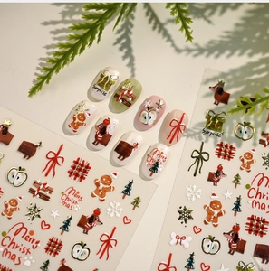 Macro view of Christmas nail stickers with gingerbread man and dachshund designs