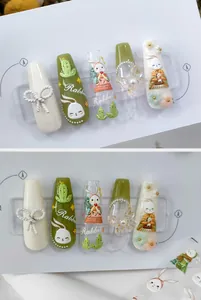 Detail of 3D rabbit nail stickers with pearls and floral relief on white card