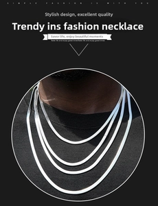Detail of layered silver stainless steel snake chains with flat polished finish