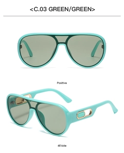Detail view of mint green aviator sunglasses with gold metal hollow decorative accents