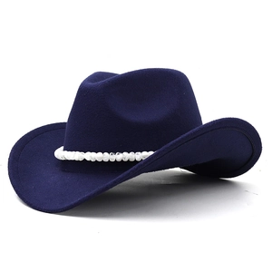 Detailed view of navy blue wool felt cowboy hat with white bead trim and curved brim