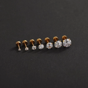 Set of seven gold titanium steel stud earrings with sparkly graduated cubic zirconia