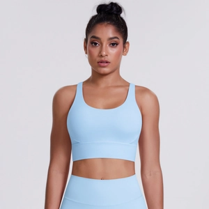 Close-up of seamless cross back sports bra in light blue matte high-stretch fabric