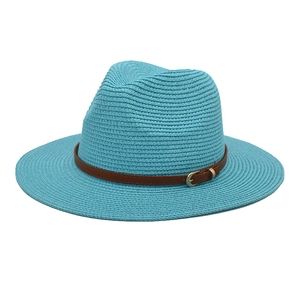 Close-up of light blue straw fedora hat with brown leather belt and gold buckle