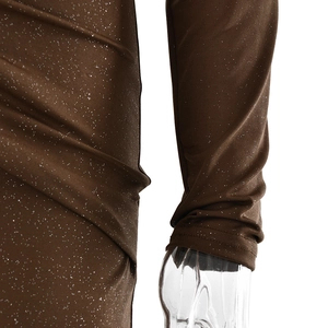 Close-up detail of dark brown dress with shimmering silver glitter fabric and side ruching