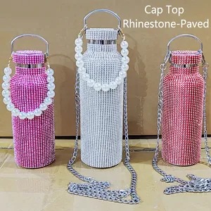 Sparkly rhinestone thermos with pearl handle and metal chain in red, silver, and pink