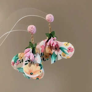 Floral fabric tassel earrings featuring pink woven roses and vibrant petal pendants