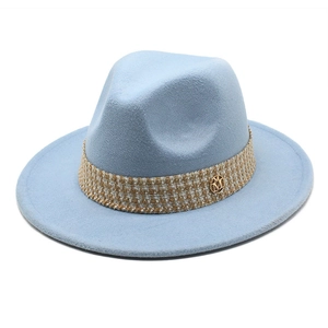 Detailed view of light blue wool fedora with M logo and braided trim detail