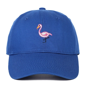 Close-up of fine pink flamingo embroidery on a navy blue cotton baseball cap