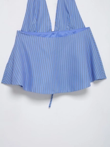 Detail of blue and white vertical striped halter top with back zipper closure