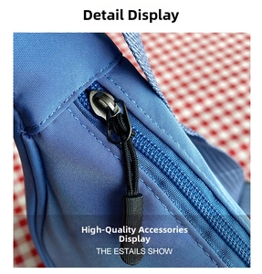Close-up of durable black metal zipper and non-slip puller on a blue nylon bag