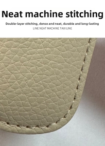 Macro detail of neat stitching on the beige lychee pattern leather car glasses clip