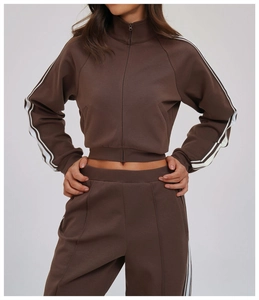Close-up of dual-tone side stripes and stitching on the brown sports jacket sleeve