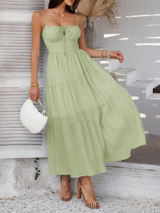 Detail view of light green tiered maxi dress with drawstring chest and pleated fabric texture