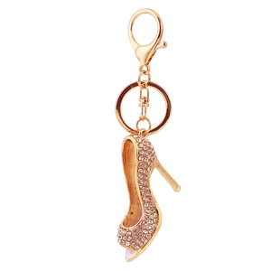 Golden high heel keychain with pink rhinestones, features lobster clasp and ring