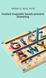 Close-up of wooden magnetic letter maze toy showing colored beads and magnetic stylus