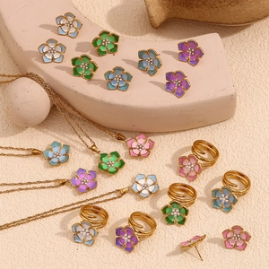 Detailed set of 18K gold plated flower jewelry with colorful enamel and pearls