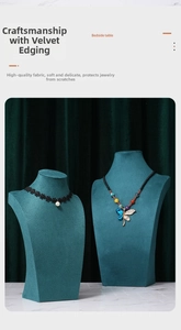 Detail of dark green velvet necklace busts in small and large sizes for jewelry display