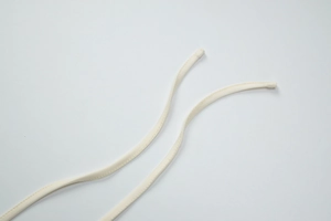 Detailed close-up of cream lace tank top drawstrings showing high quality fabric texture