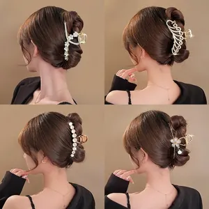 Set of 4 elegant 11cm metal hair claw clips with pearls and rhinestones for women.