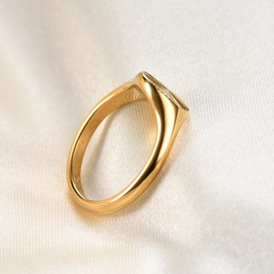 Modern 18K gold-plated stainless steel signet ring with radial sunburst texture