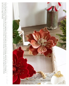 Close-up of velvet Christmas flowers with glitter edges on a wooden tray decor