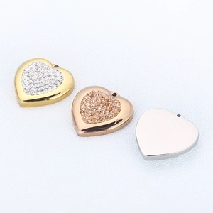 Three heart pendants in gold, rose gold and silver with cubic zirconia and smooth back