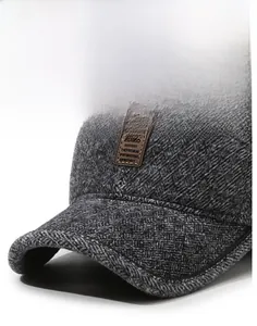 Detail of grey winter baseball cap showing sturdy brim and textured fabric weave