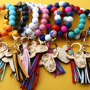 Western boho wristlet keychains with silicone beads, cow head tags, and fringe tassels