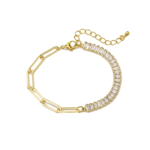 Detailed close-up of 18K gold plated bracelet with T-shaped cubic zirconia and lobster clasp