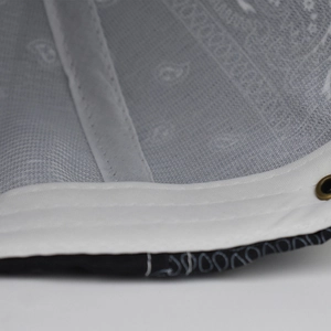 Detailed close-up of paisley pattern baseball cap with white sweatband and metal eyelet