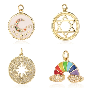 Gold celestial jewelry charms with moon, star, and rainbow patterns in a 2x2 grid