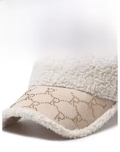 Detailed macro view of beige faux shearling baseball cap with rhinestone accents