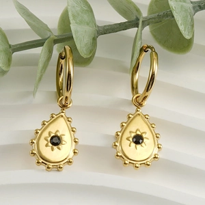 Gold stainless steel teardrop earrings with sunburst pattern and black gemstone inlay