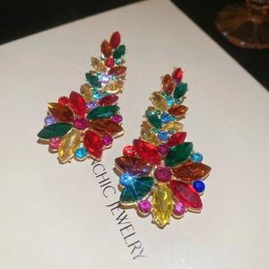 Detailed macro of vibrant floral crystal earrings featuring multicolored rhinestones
