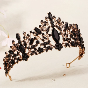 Vintage black and gold gothic crown with intricate baroque floral patterns and rhinestones