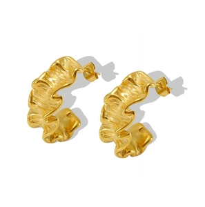 Detail shot of gold-plated 18k stainless steel earrings with unique wrinkled wave texture