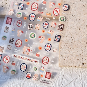 Japanese style PET nail stickers featuring brown bears, tulips, and cupcakes on beige stone