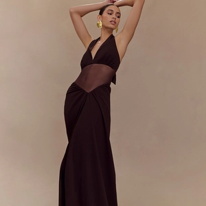 Sultry dark brown halter neck maxi dress with sheer mesh waist panel and deep V-neckline