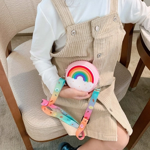 Pink silicone kids rainbow crossbody coin purse with colorful adjustable strap on model
