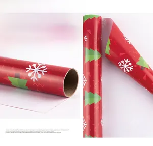 Macro detail of 80g art paper gift wrap featuring red Christmas tree and snowflake patterns