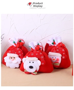 Three festive Christmas drawstring gift bags featuring Santa, Polar Bear, and Snowman dolls