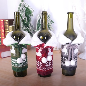 Christmas knit wine bottle covers with reindeer patterns and faux fur trim decor