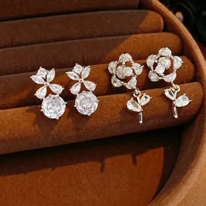 Elegant silver earrings set featuring hollow floral designs and sparkling cubic zirconia