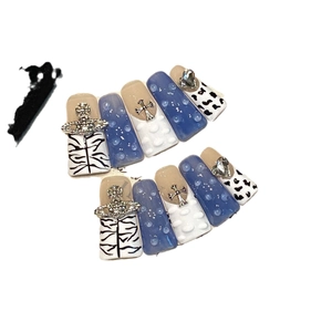 Handmade Y2K press-on nails with blue zebra print, 3D water drops and planet charms