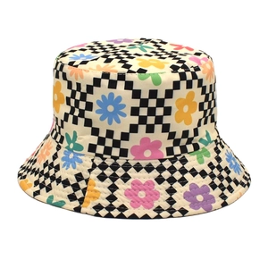 Close-up of black and white checkered bucket hat with colorful daisy floral embroidery